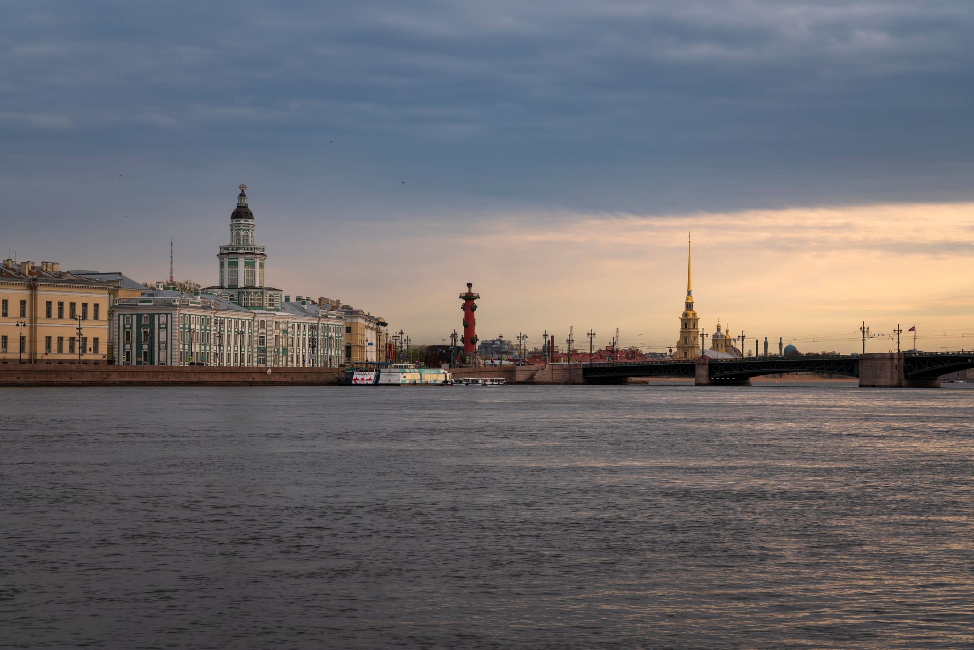 View of the Neva River, University Embankment, the Kunstkamera building, Peter and Paul Fortress and the Palace Bridge on a spring morning, St. Petersburg, Russia